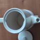 Small coffee maker with floral decoration