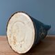 Old painted sheet metal jug or milk jug