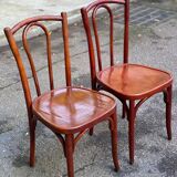 2 curved solid wood bistro chairs in Bordeaux.