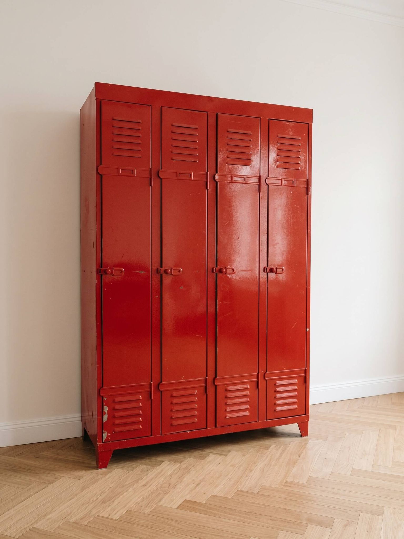 Vintage industrial wardrobe with 4 metal doors in red.