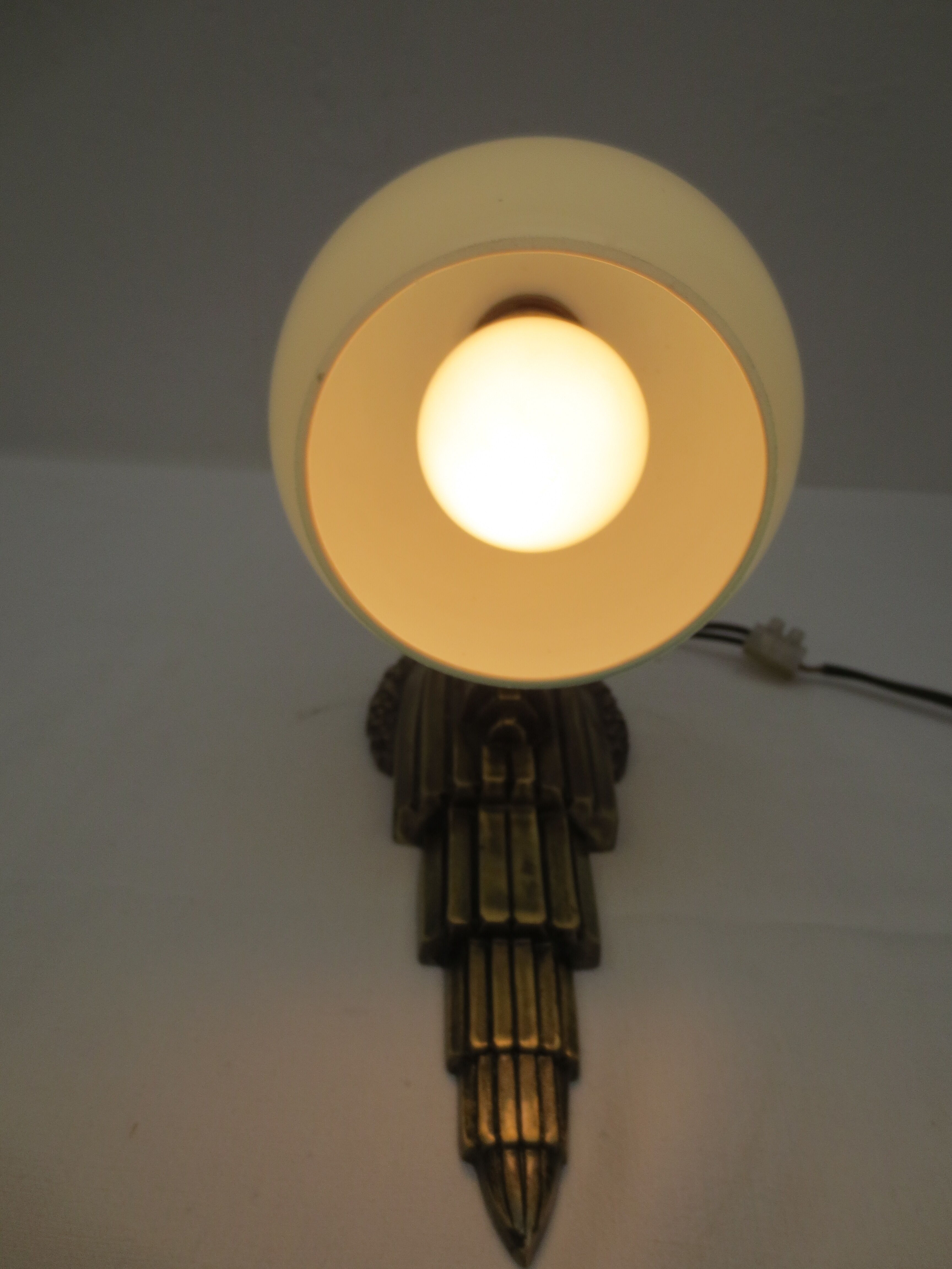 Art deco wall lamp in brass and soft blue opaline globe