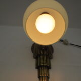 Art deco wall lamp in brass and soft blue opaline globe