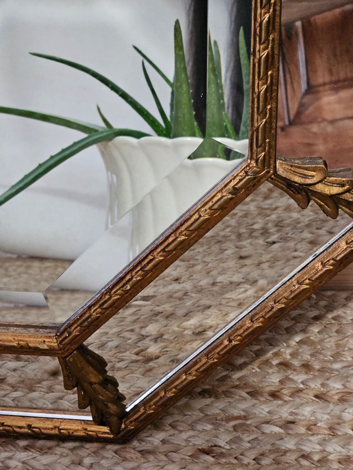 Bevelled mirror with neoclassical parcloses from the 20th century.