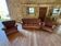 Living room with a three-seater sofa and two armchairs.