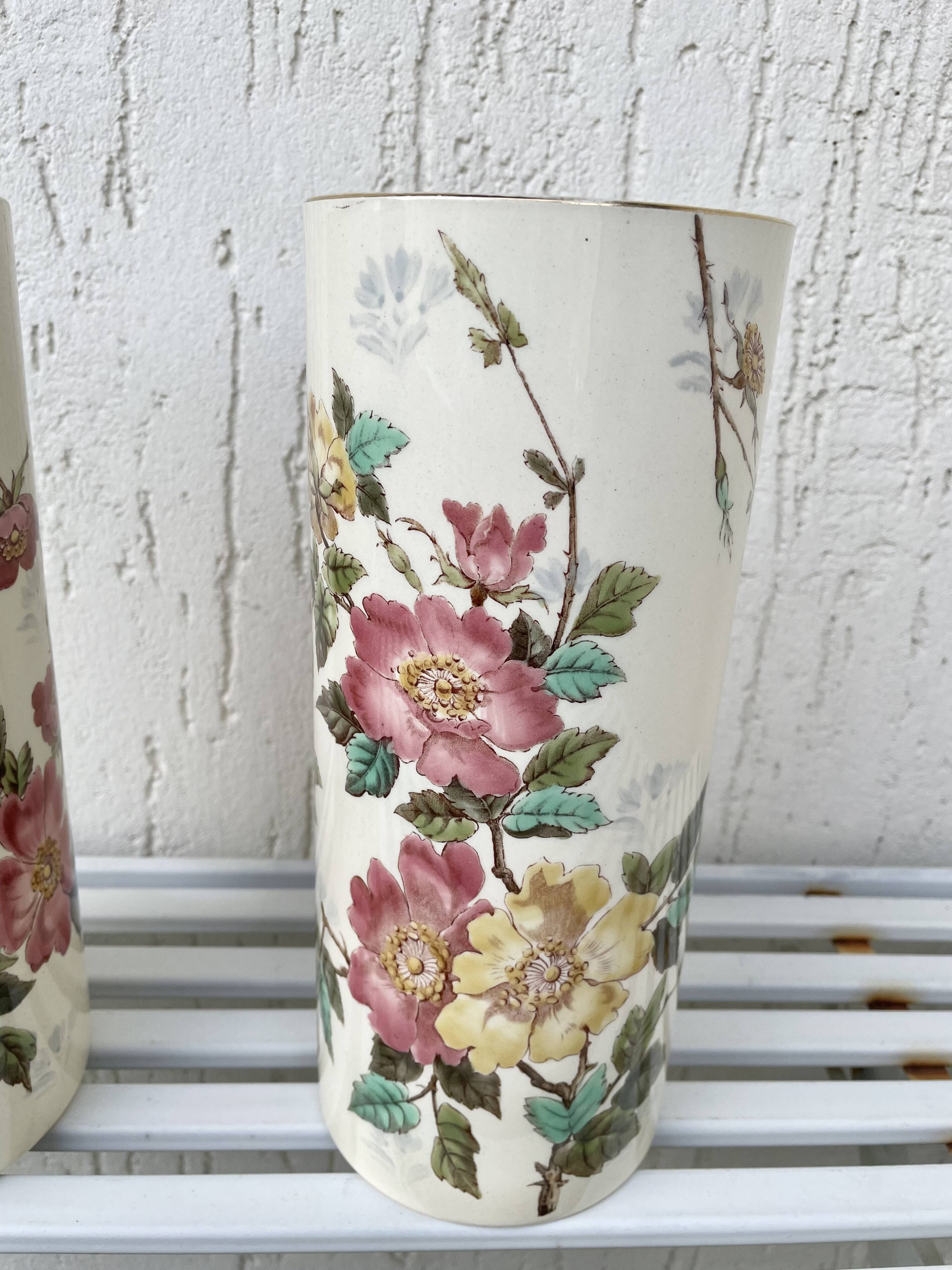 Roller vases in earthenware with floral decoration of wild rose, circa 1930–1950.