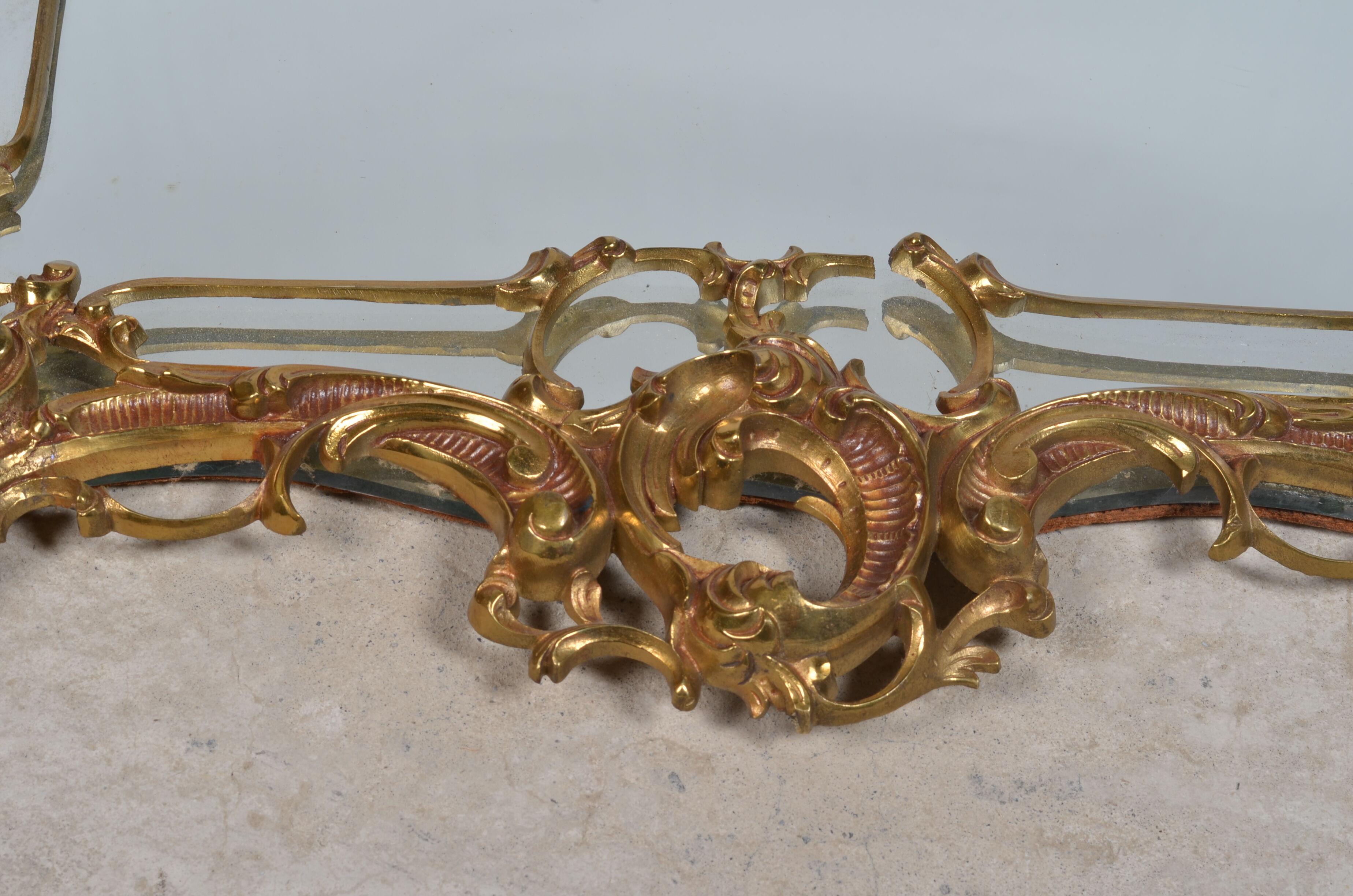 Mirror with baroque style parecloses in bronze 102 x 61 cm