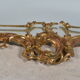 Mirror with baroque style parecloses in bronze 102 x 61 cm