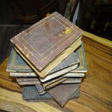 side table, end of sofa stack of wooden books, old, beautiful patina