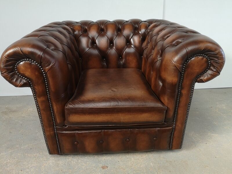 Brown leather chesterfield armchair