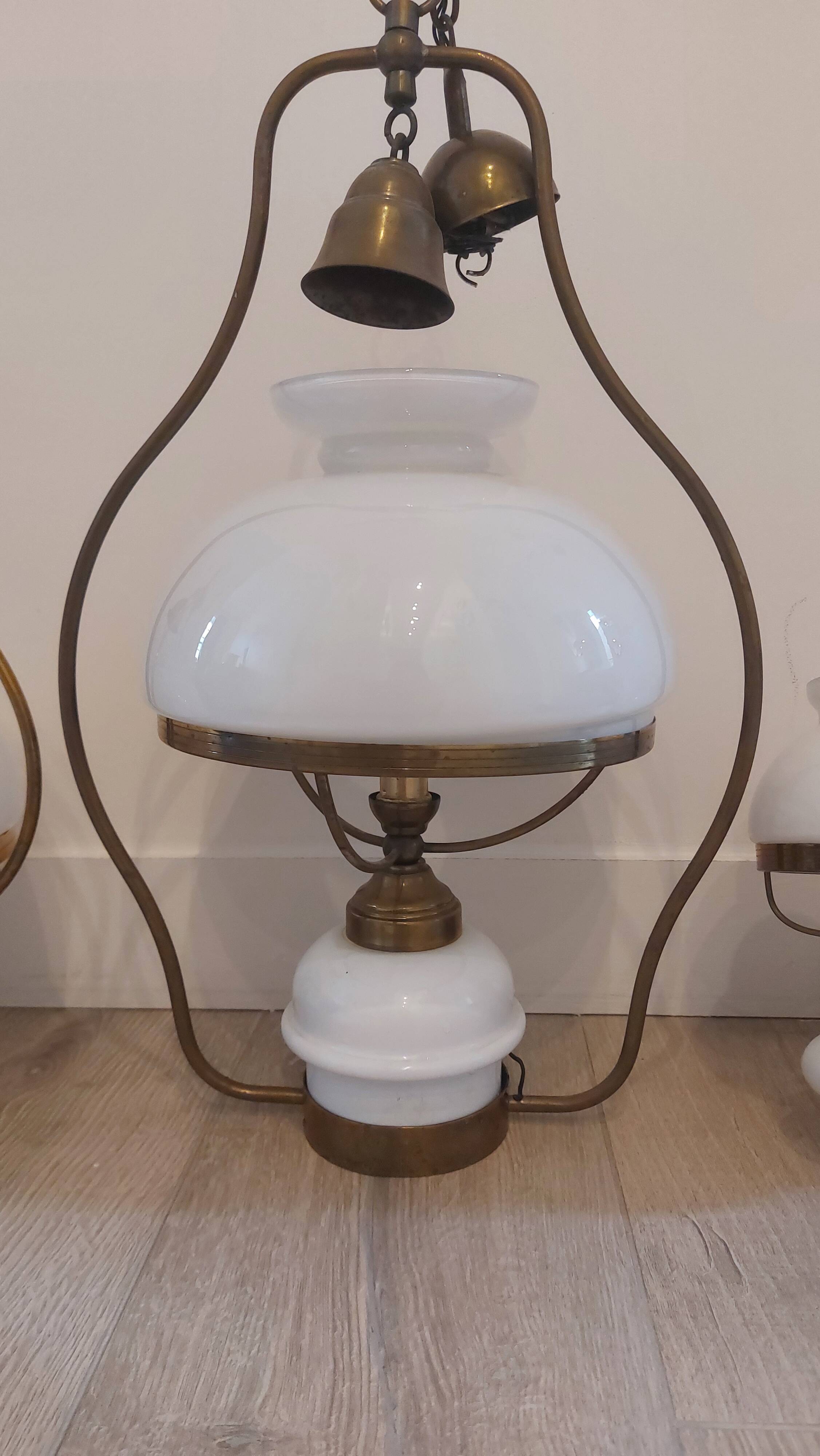 Lots of 1950s copper/ brass suspensions and wall lights with shades.