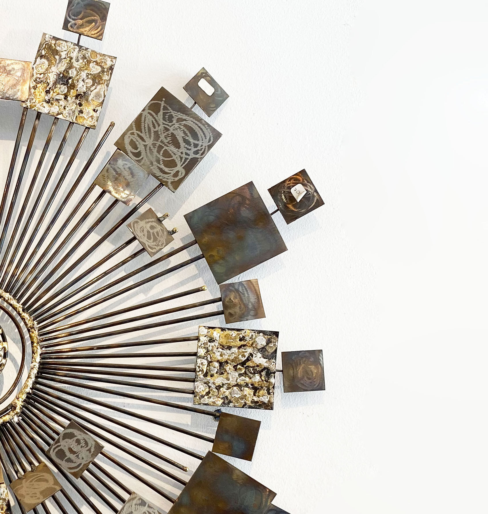 Brutalist Sunburst wall sculpture by Curtis Jere. USA, 2000s