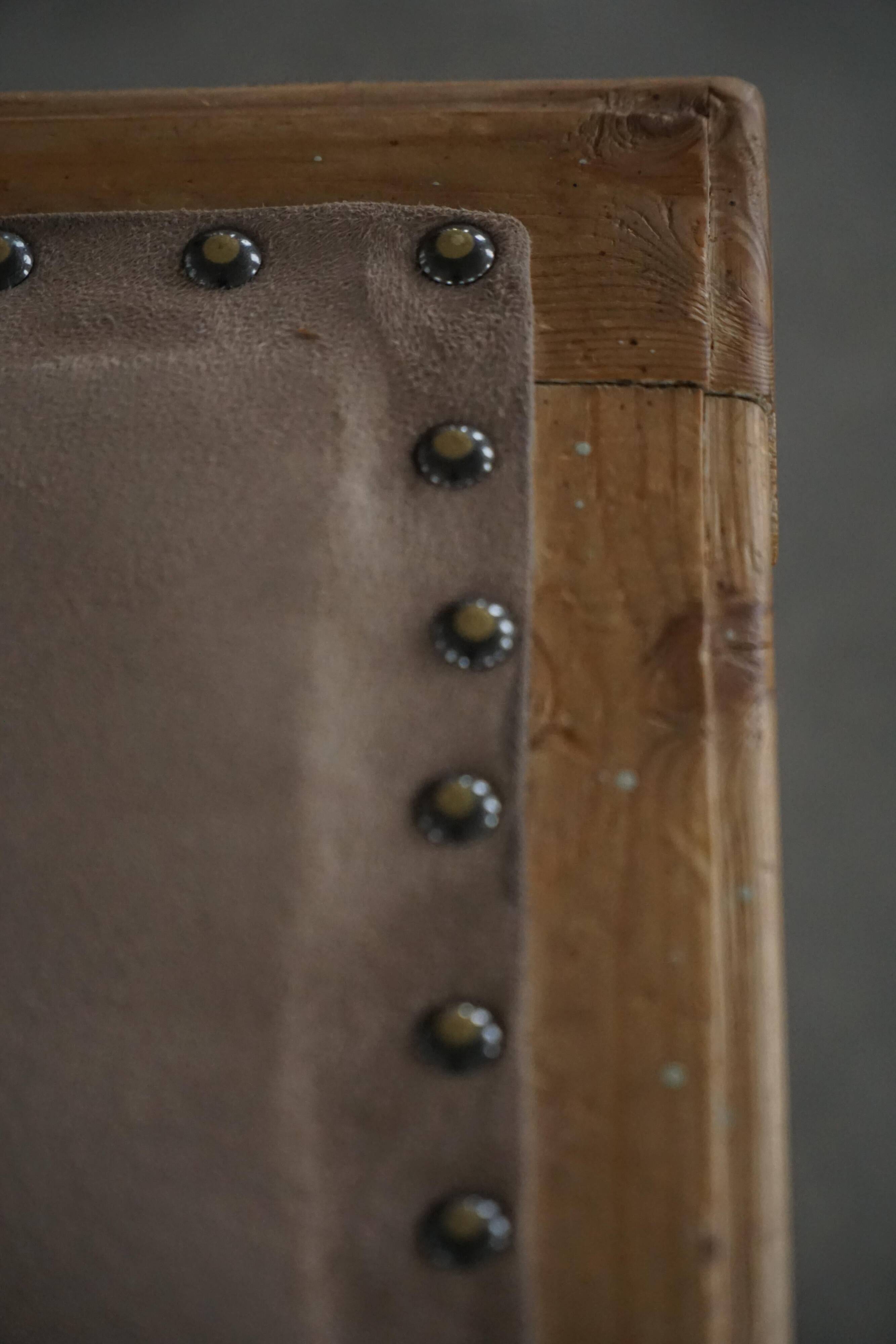 A pair of antique Danish pine stools from the late 19th century.