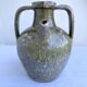 Ancient oil jar in glazed terracotta, khaki green — Auvergne, Lezou