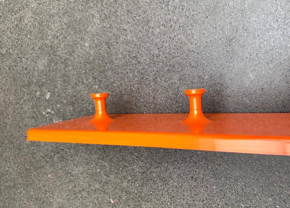 Orange coat rack from the mid-century space age, 1960s.
