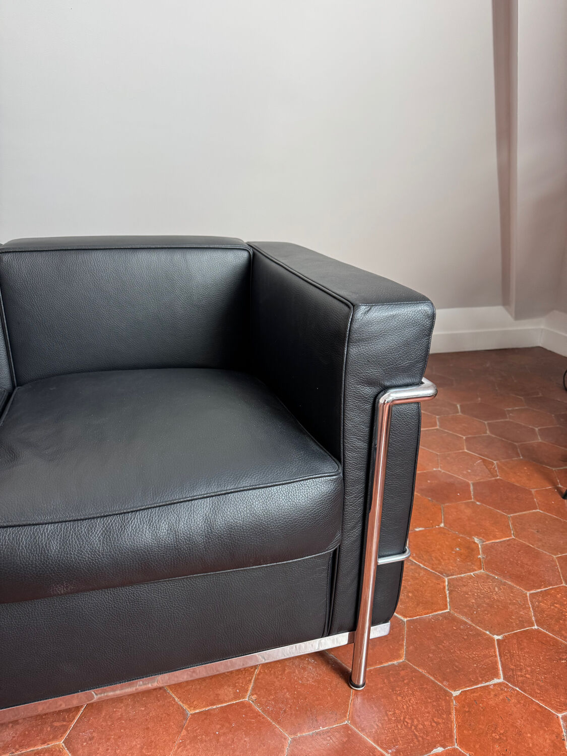 For sale: designer two-seater sofa.