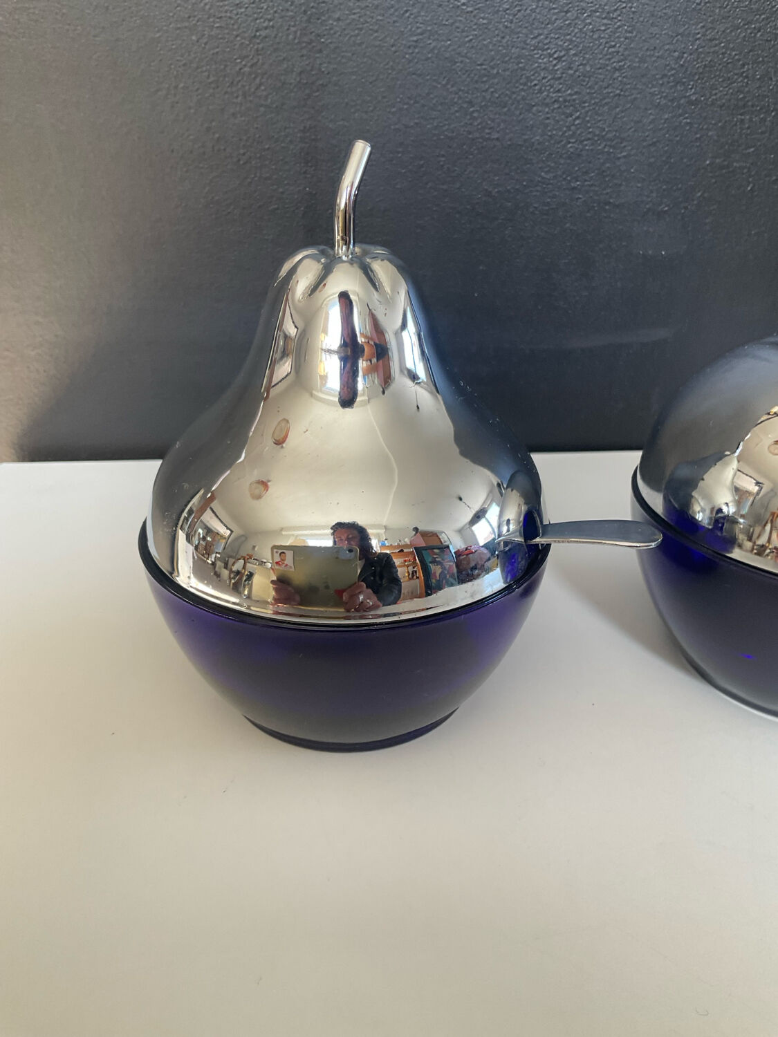 A pair of vintage cobalt glass and silver-plated sugar bowls.