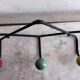 Wall coat rack Roger Feraud, metal and wooden balls.