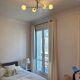 Lustre Cassius with 6 white glass globes and gold metal.