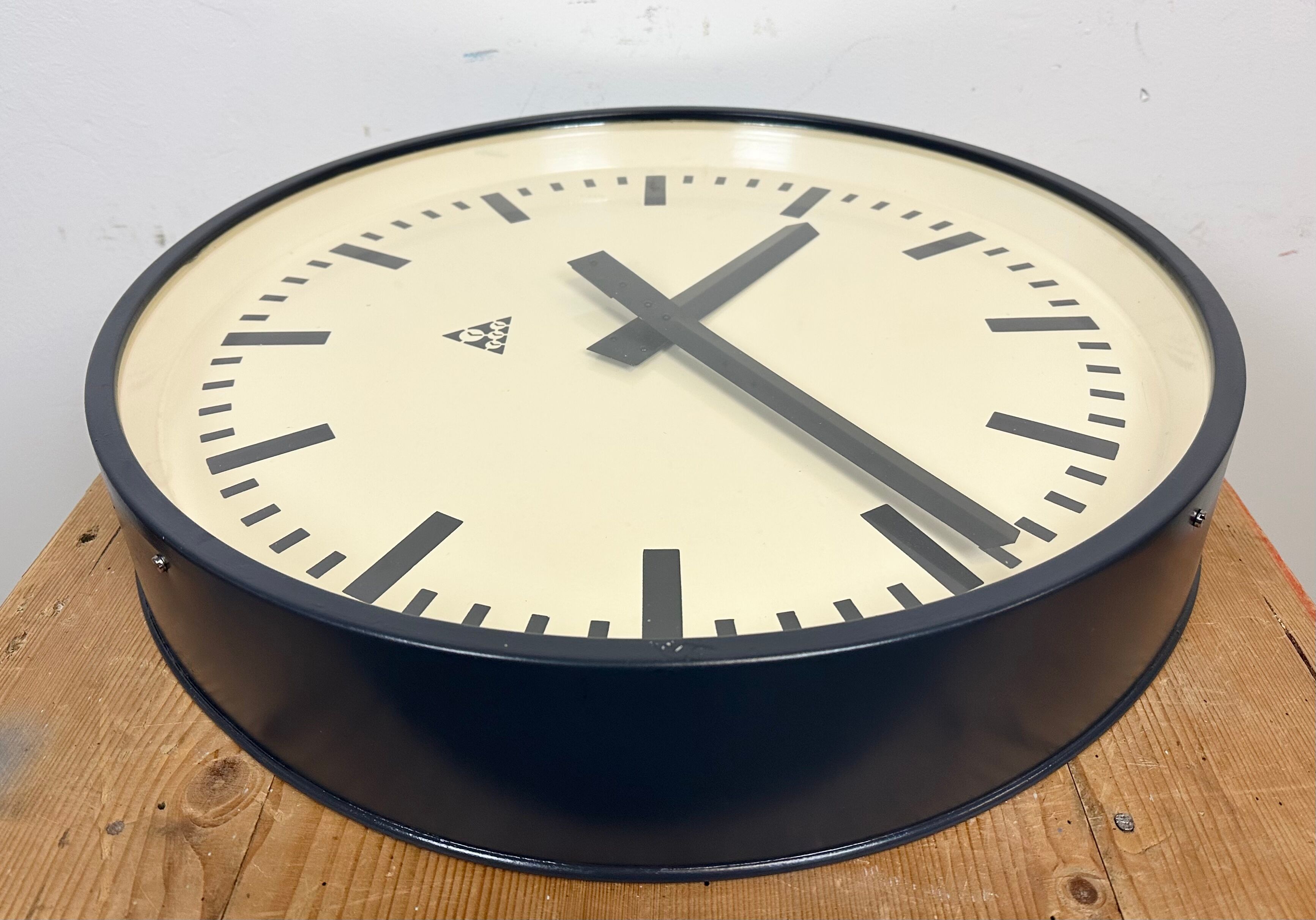 Grey industrial factory wall clock from pragotron, 1960s