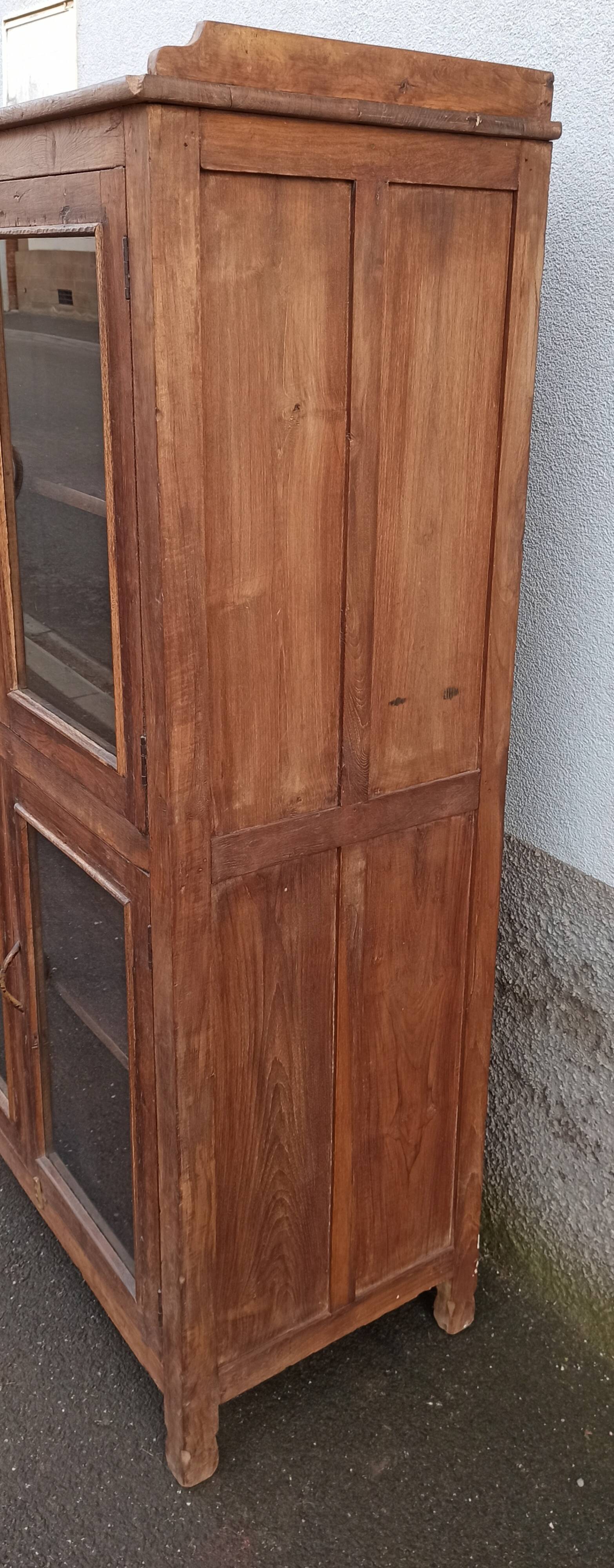 Old wooden glazed cabinet with four doors