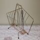 Vintage magazine holder in gilded brass.