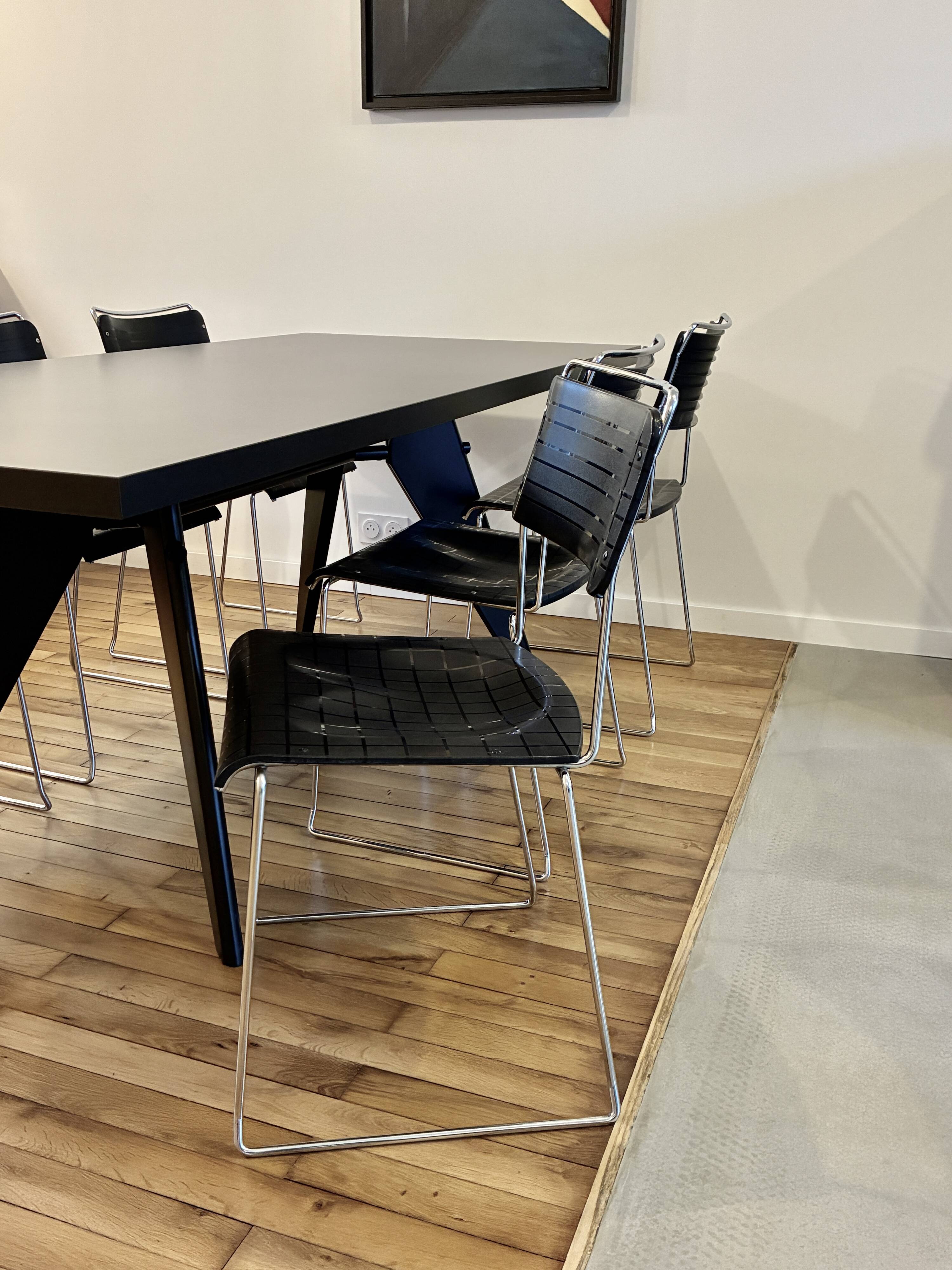 4 Spilimbergo chairs from Italy in chrome steel and black plastic.