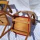 Pair of wooden armchairs and skaï foot compass of the 50s