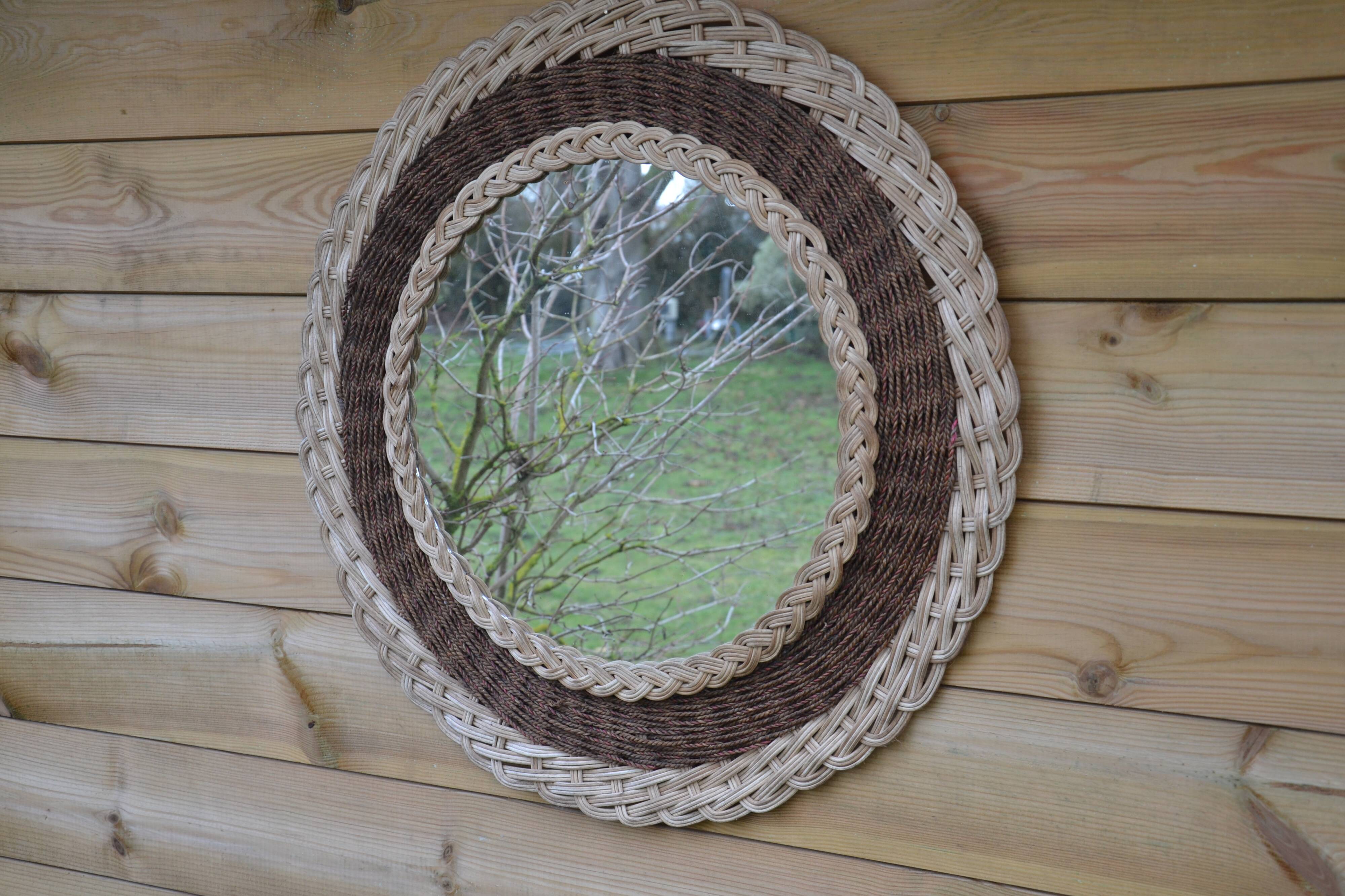 Round woven rattan mirror with rope from the 1970s.