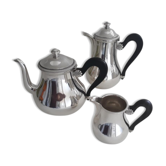 Silver metal service teapot coffee maker and milk pot decorated with godrons and shells