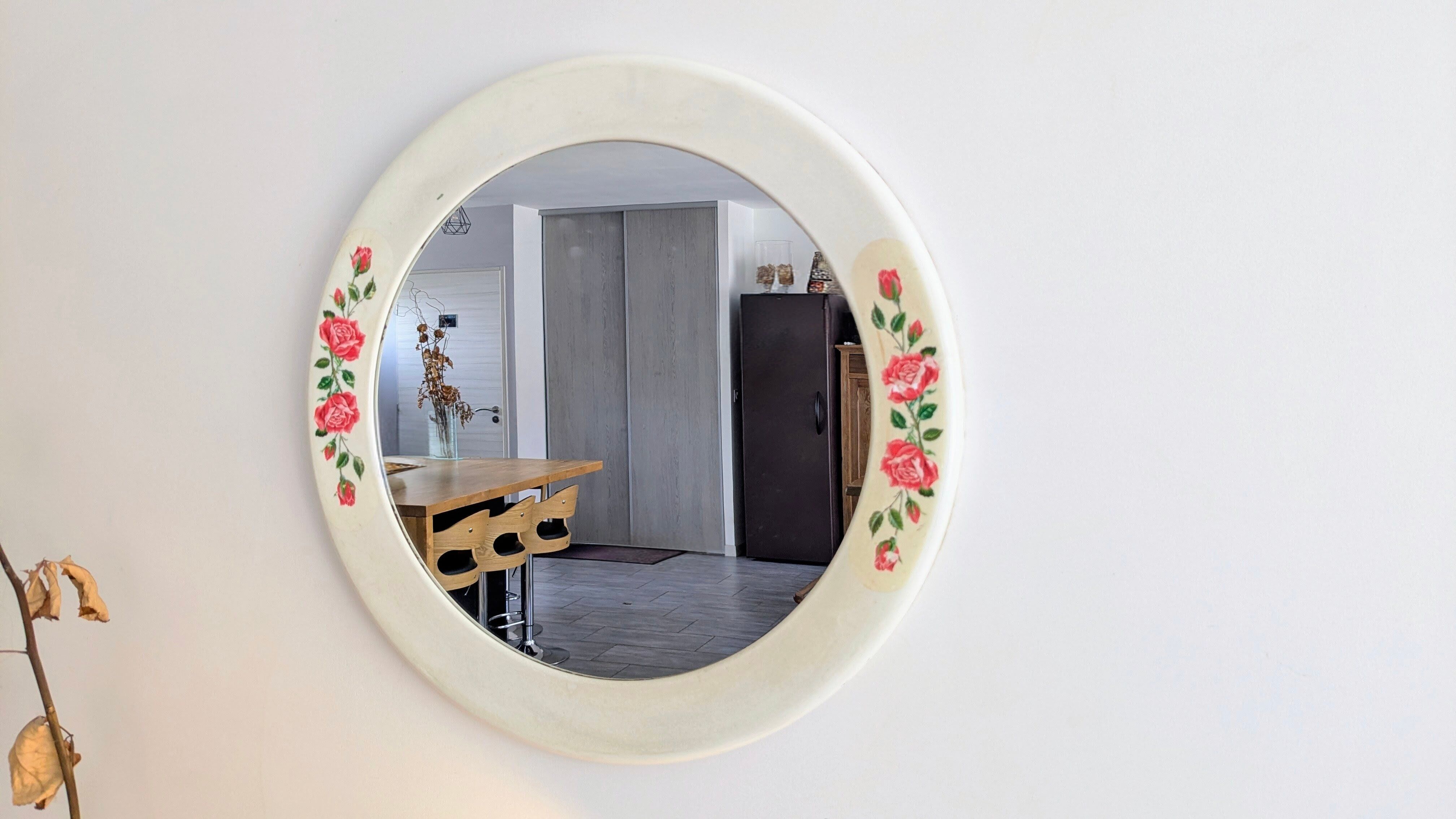 Vintage round mirror Syla model 6131 with rose decoration.