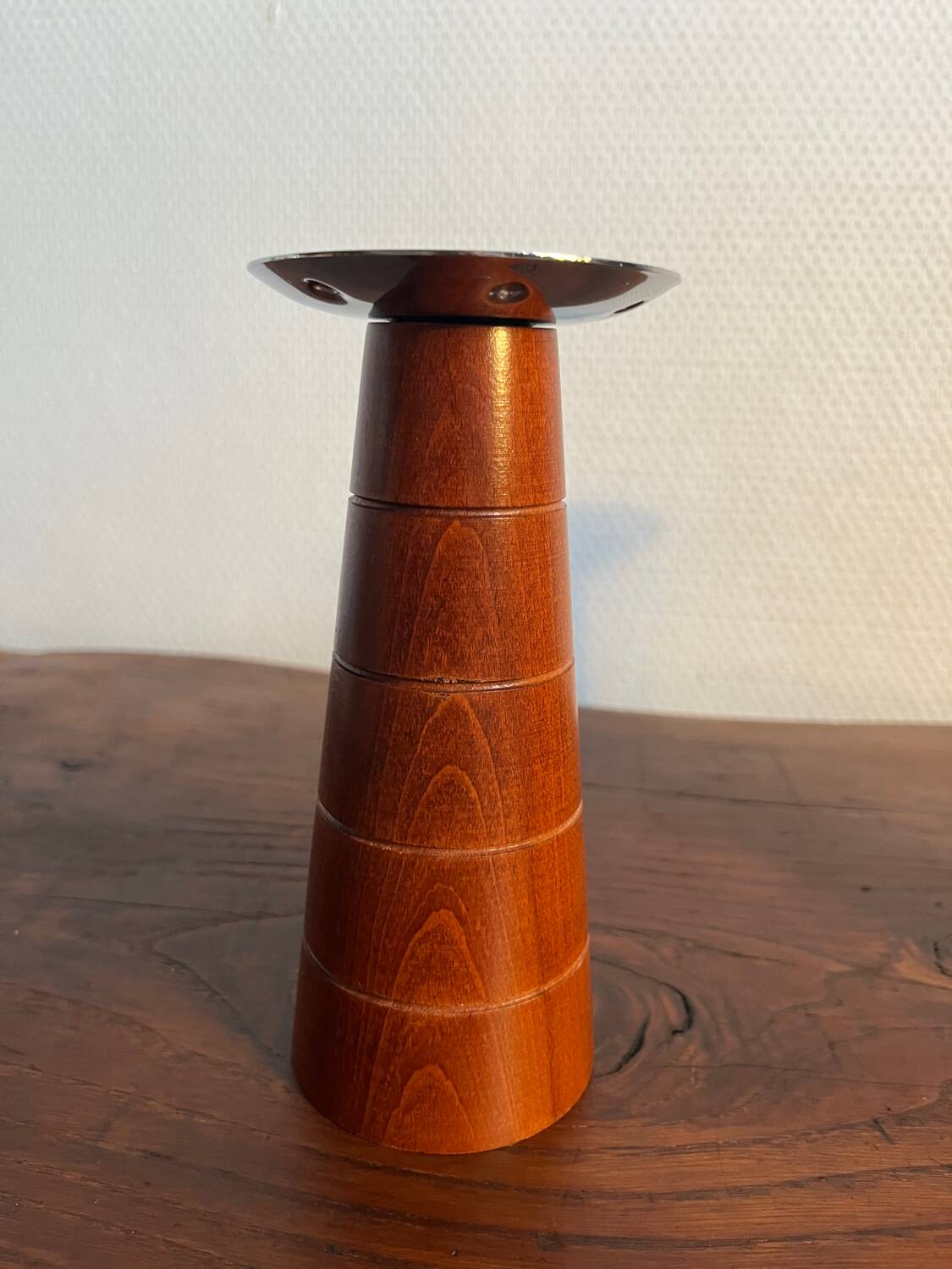 Pair of Guy Degrenne wooden and stainless steel candlesticks