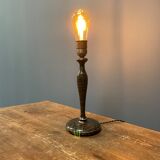 Black table lamp with paint splatters from the 1920s