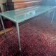 Glass and metal desk with wheels