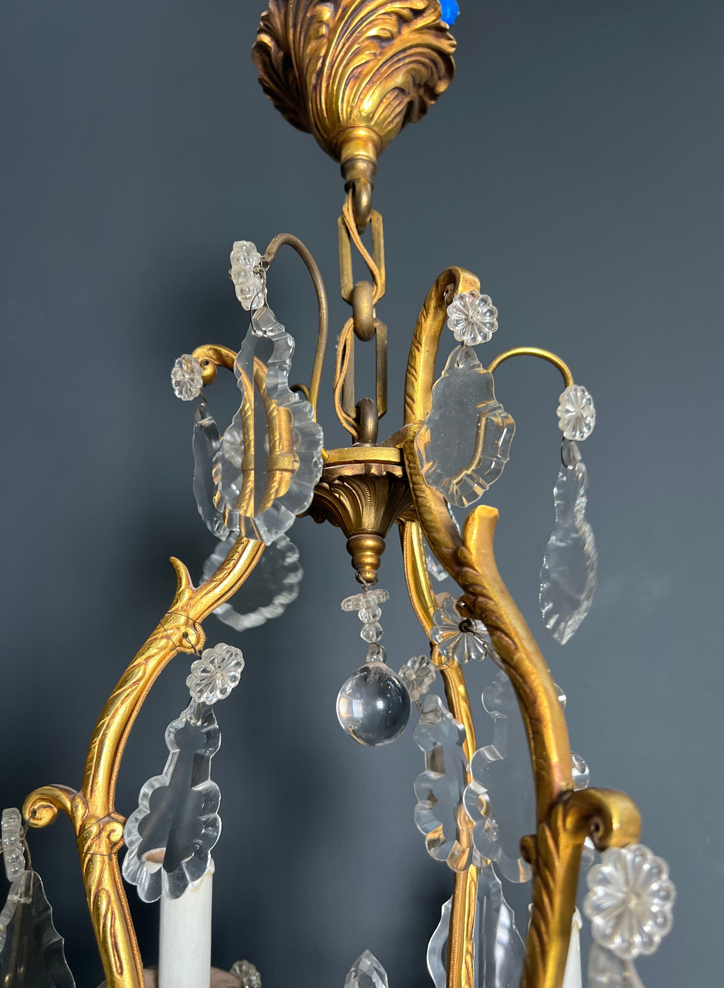 Louis XV style bronze chandelier with crystals and 6 lights