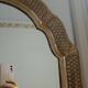 Italian mirror with a sculpted patinated arch, neo-Renaissance style.