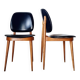 Paire de chaises vintage 1960 – Pieds compas & Simili-cuir noir