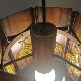 Older hanging lamp, made of metal with yellow prisms.