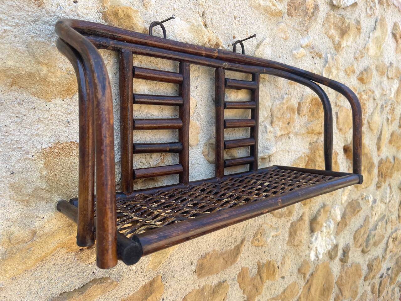 Vintage wall shelf in bamboo and rattan, circa 1960s.