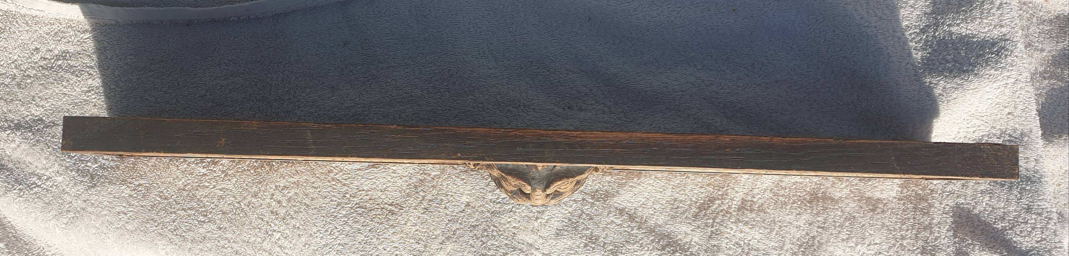 Carved wooden pediment with bunches of grapes