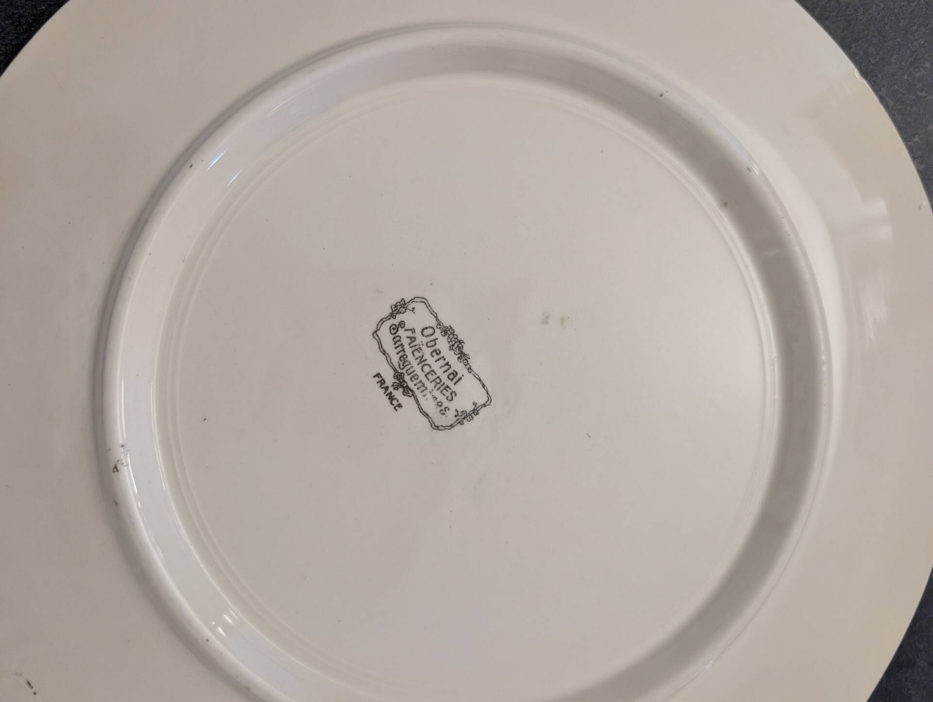 Two earthenware dishes from Obernai signed Henri Loux.