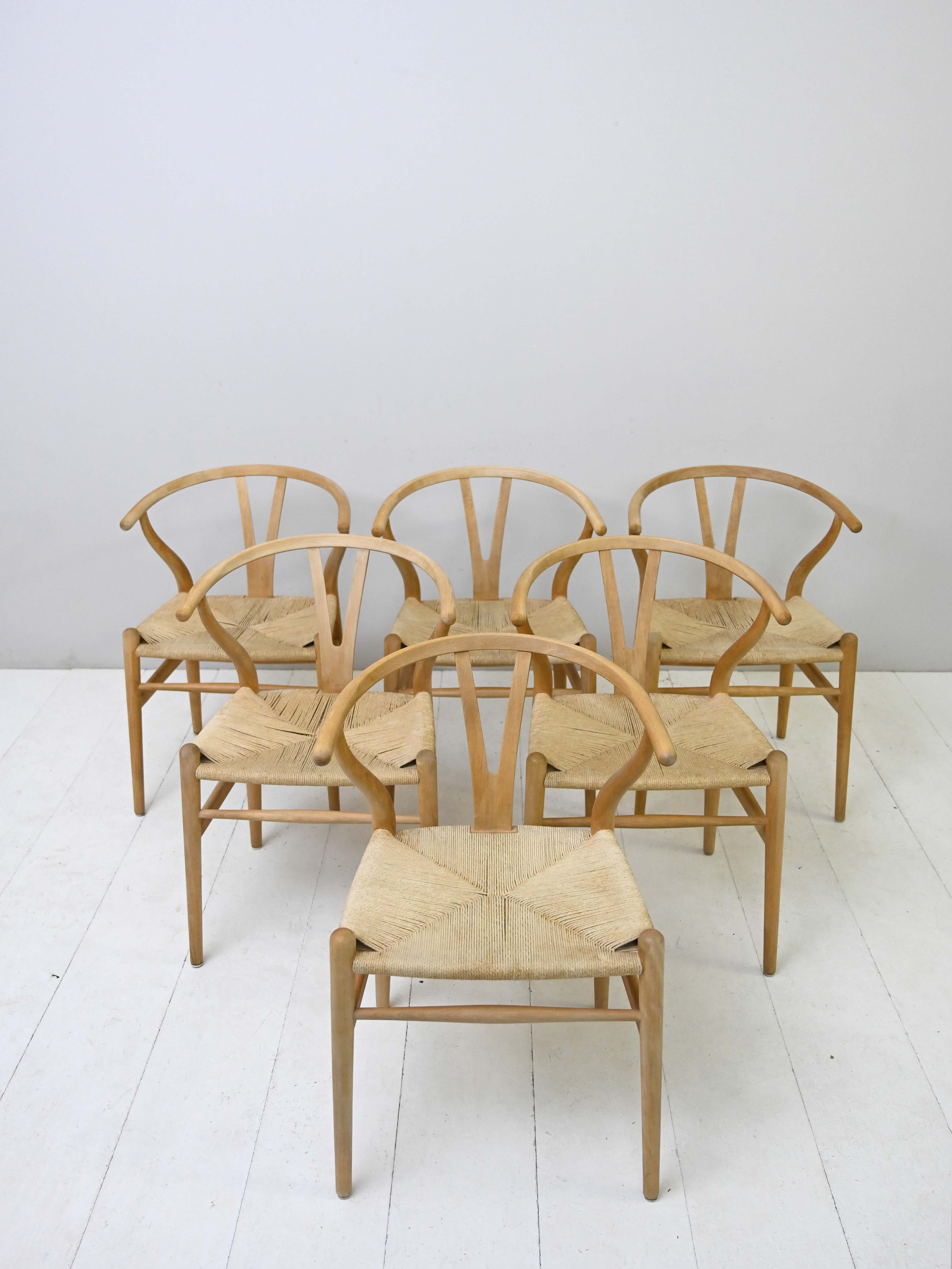 Set of six 'Wishbone chair' model chairs by Hans J. Wegner with leather cushions