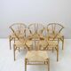 Set of six 'Wishbone chair' model chairs by Hans J. Wegner with leather cushions