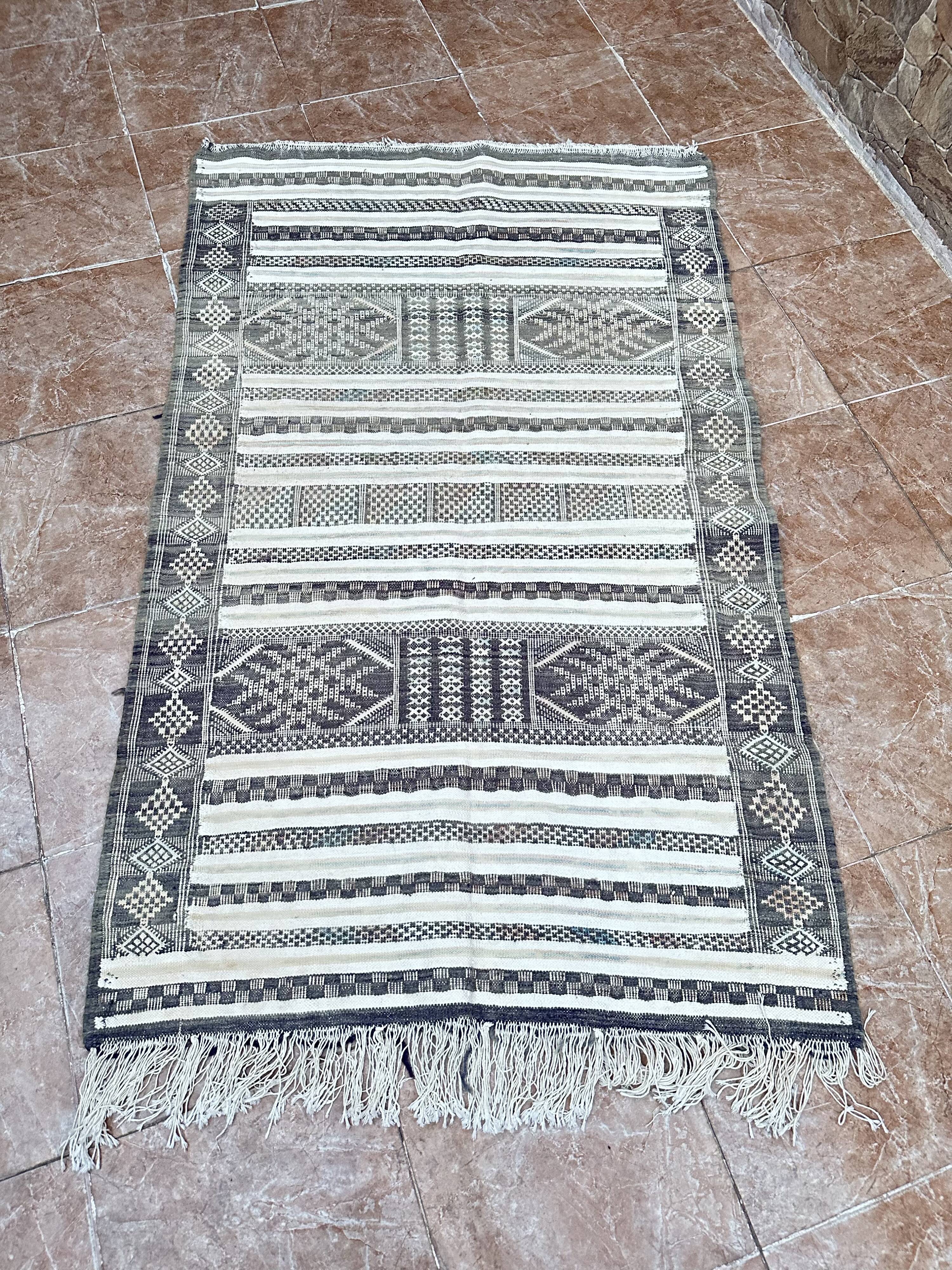 Handwoven Kilim rug made of camel wool, silk, and cactus.