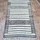 Handwoven Kilim rug made of camel wool, silk, and cactus.
