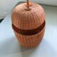 Wicker box shaped like a fruit.