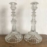 Pair of moulded glass candlesticks, ram heads and masks