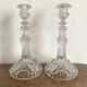 Pair of moulded glass candlesticks, ram heads and masks