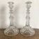 Pair of moulded glass candlesticks, ram heads and masks