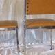 Pair of modernist chairs in chromed metal and imitation leather