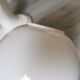 White ceramic hand wall lamp